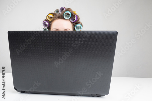 Woman head in curlers. Girl...