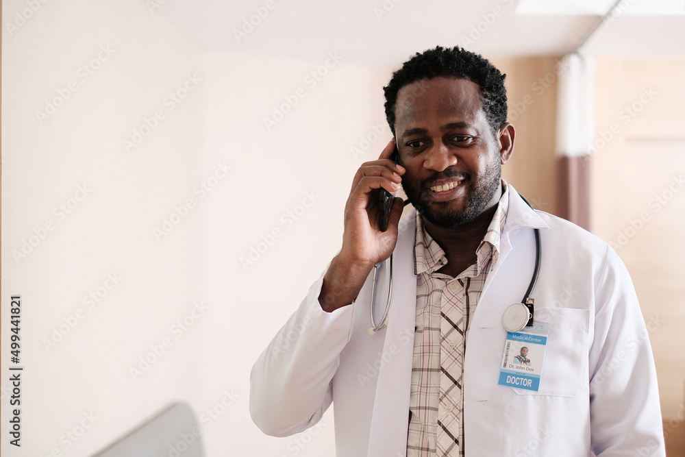 Cheerful mature doctor posing and smiling at camera, healthcare and medicine. Cheerful mature doctor posing and smiling at camera, healthcare and medicine.