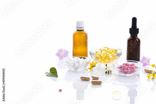 Various vitamin capsules and dietary supplements isolated on white background with copy space. Vitamin complexes concept.