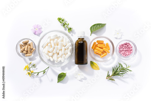 Flat lay composition of various vitamin capsules and dietary supplements isolated on white background. Vitamin complexes concept. photo