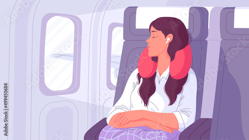 Woman sleep in flight with pillow around her neck in airplane seat