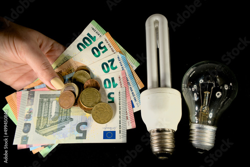 The concept of the cost of electricity. Electric lamp and euros of Europe