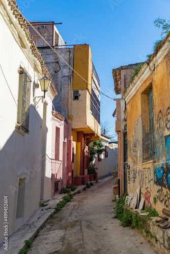 ATHENS, GREECE - DECEMBER 20, 2021: Traditional houses and small streets at Anaphiotika district near Acropolis Hill. © umike_foto