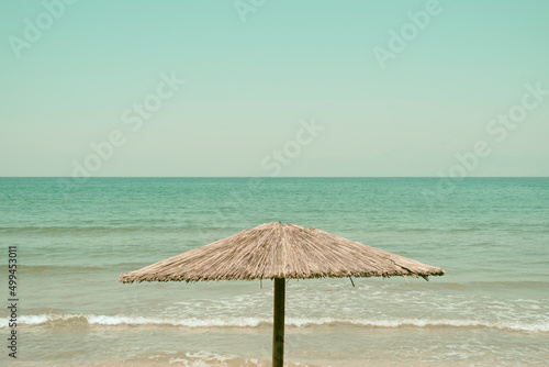 Rustic parasol against the sea