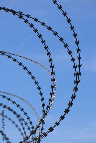 Barbed wire on the fence to ensure the protection of the territory