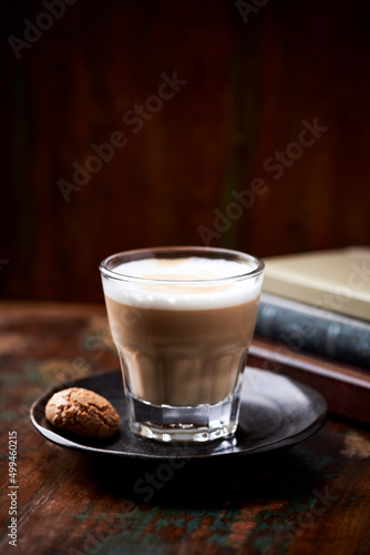 Coffee with milk on rustic wooden background. Soft focus. Close up. Copy space. 