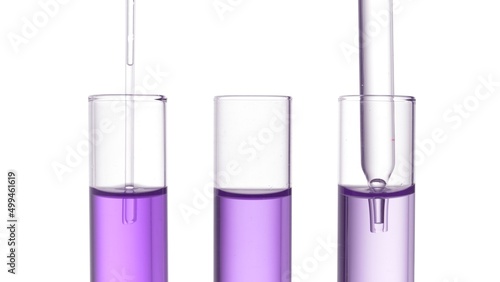 Three test tubes with purple liquid and chemical droppers on white background | Abstract skin care cosmetics formulation concept