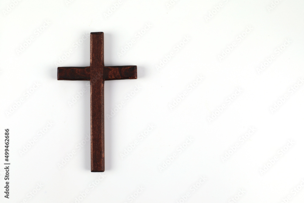 Wooden christian cross on white background with space to write.