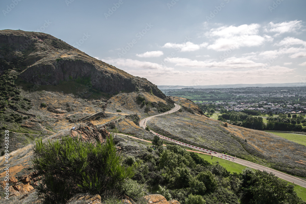 Naklejka premium Scotland, Edinburgh. Holyrood park and ancient volcano. Beautiful panoramic view City of Edinburgh from the mountain