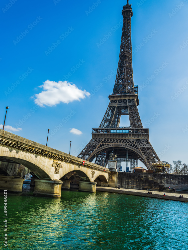 Eifel tower from river Seine with blue sky in Paris