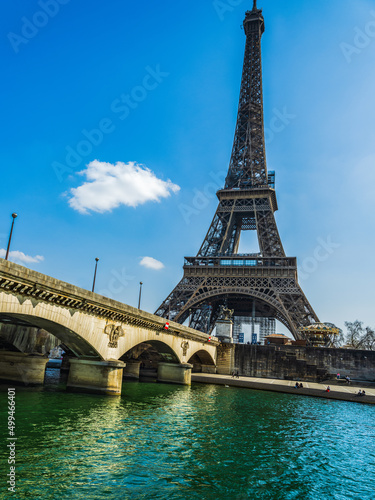 Eifel tower from river Seine with blue sky in Paris