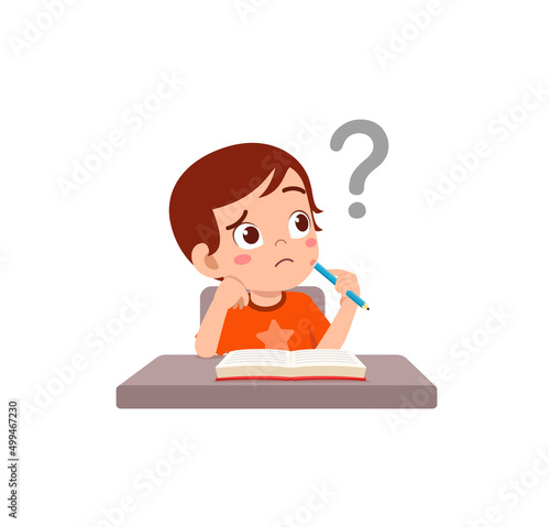little kid reading book and feel confused