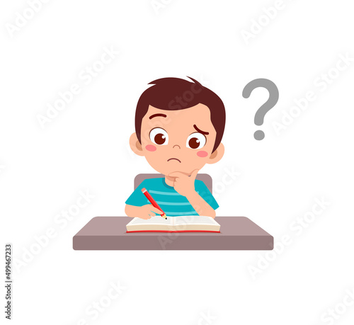 little kid reading book and feel confused