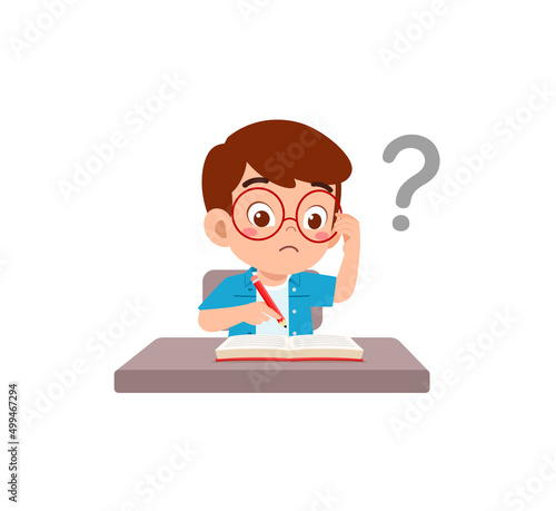 little kid reading book and feel confused