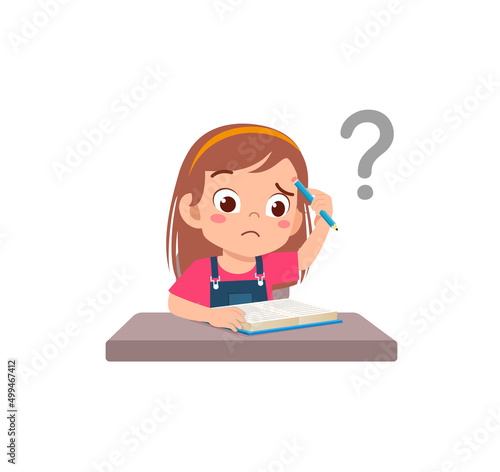little kid reading book and feel confused