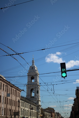 view of the church among the houses on a sunny day