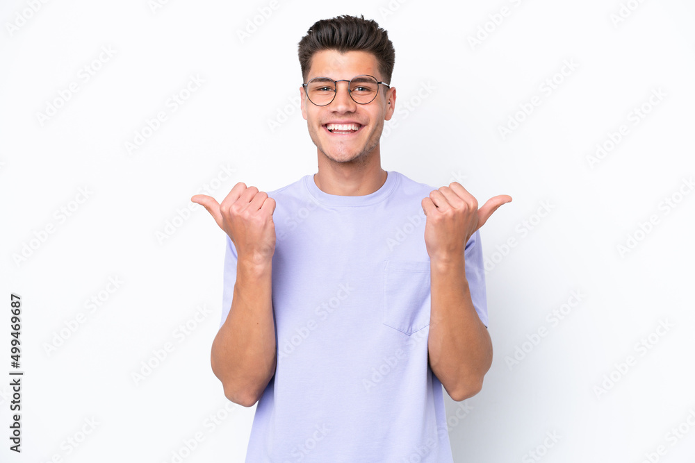 Young caucasian man isolated on white background with thumbs up gesture and smiling Young caucasian man isolated on white background with thumbs up gesture and smiling