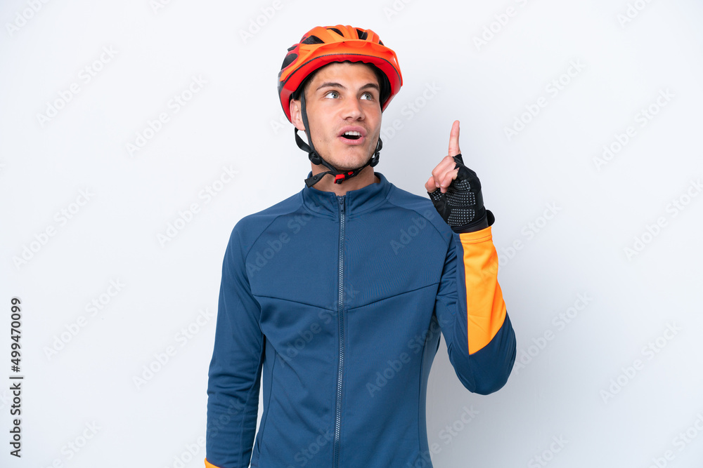 Young cyclist caucasian man isolated on white background thinking an idea pointing the finger up