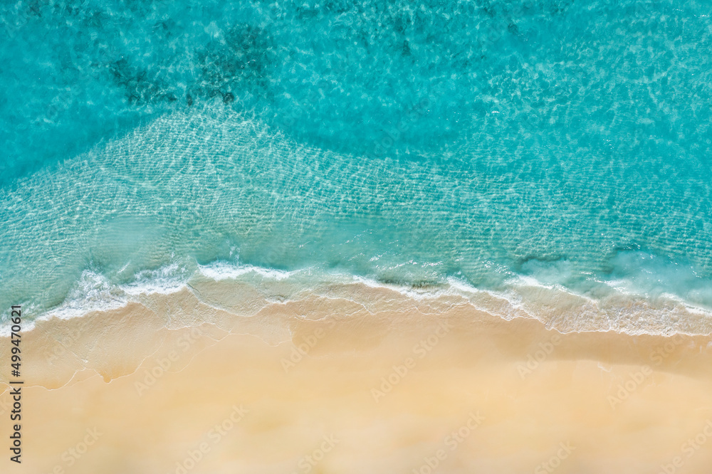 Relaxing aerial beach scene, summer vacation holiday template banner. Waves surf with amazing blue ocean lagoon, sea shore, coastline. Perfect aerial drone top view. Bright beach panorama, seaside