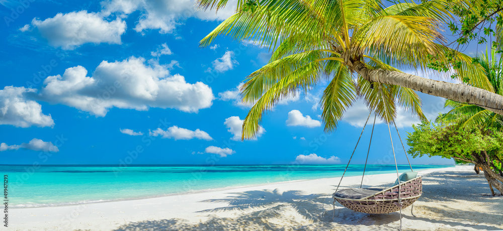 Tropical beach panorama as summer relax landscape with beach swing or hammock hang on palm tree over white sand sea beach banner. Amazing beach vacation summer holiday concept. Luxury romantic travel - obrazy, fototapety, plakaty 