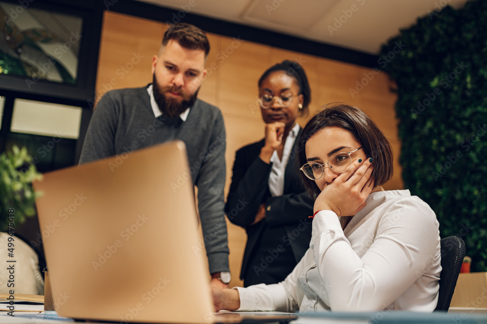 Stressed business team having a meeting in the office and solving a problem Stressed business team having a meeting in the office and solving a problem