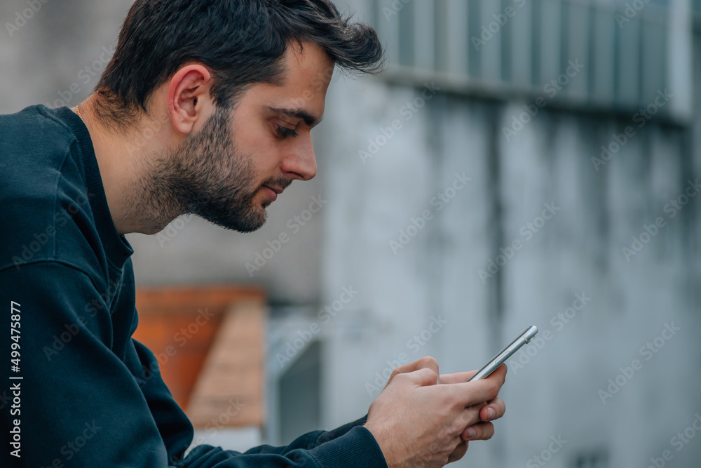 man looking at mobile phone in hand man looking at mobile phone in hand