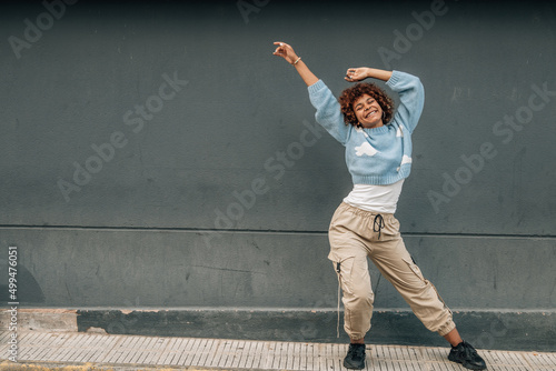 happy smiling girl dancing in the street