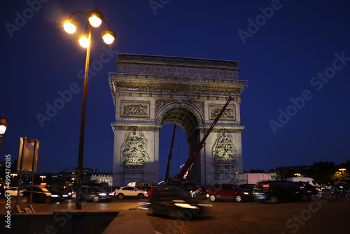 Dismantling work of a temporary art installation on the Arc de Triomphe in Paris