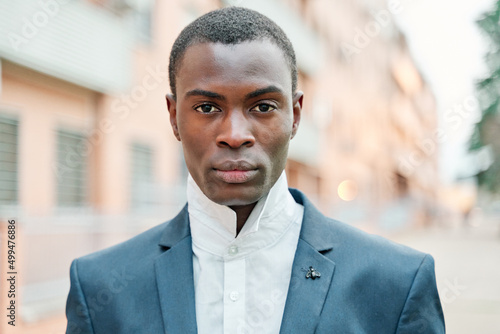 Stylish young woman in suit. Image of fashionable African American looking at the camera.