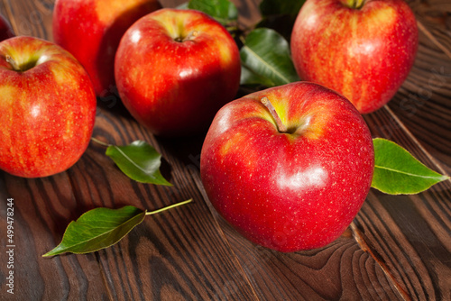 red apples on brown wood background