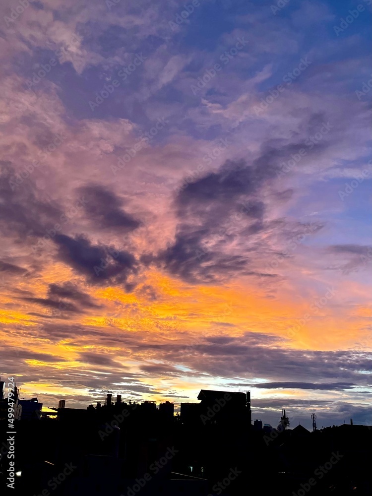 very beautiful twilight sky, a blend of orange and blue colors. beautiful view of the evening sky. clouds, sky and rainbow that adorn the atmosphere in the afternoon. Evening view in Jakarta. blur