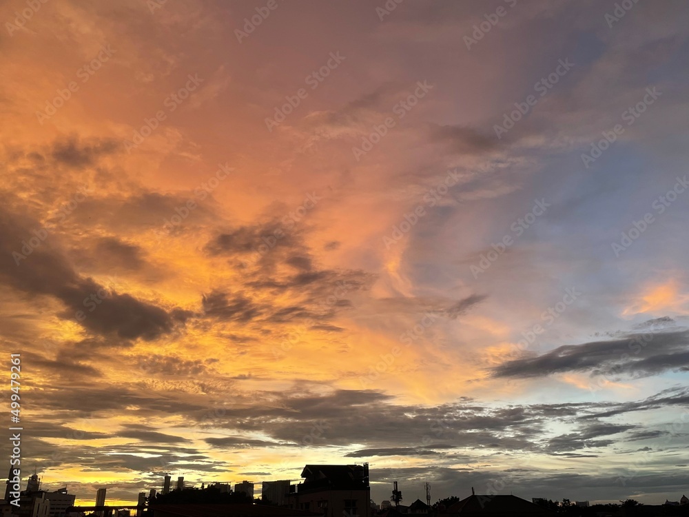 very beautiful twilight sky, a blend of orange and blue colors. beautiful view of the evening sky. clouds, sky and rainbow that adorn the atmosphere in the afternoon. Evening view in Jakarta. blur