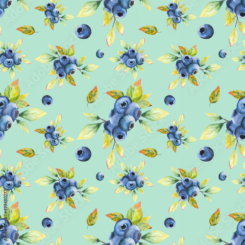 Watercolor seamless pattern. Design on a blue background with blueberry leaves. Berry seamless design.