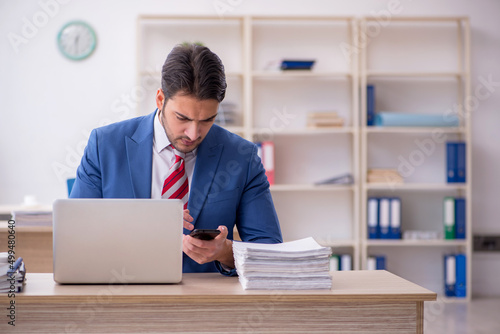 Young attractive employee working in the office