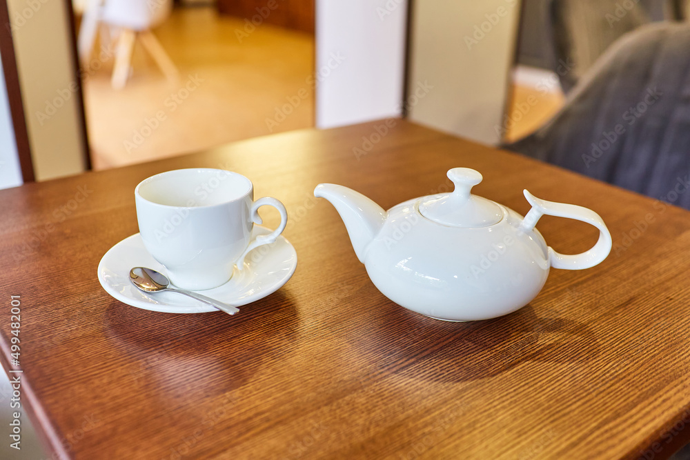 A small table setting in a cafe for one person. Break during a walk A small table setting in a cafe for one person. Break during a walk