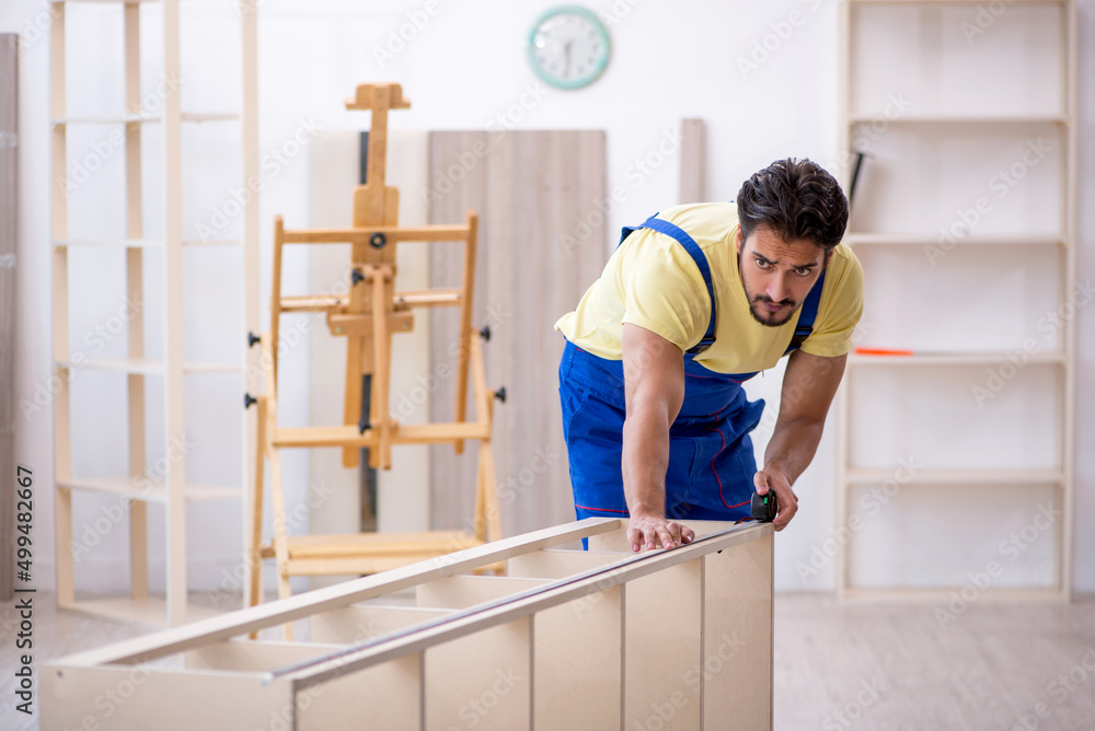 Young male carpenter working at home Young male carpenter working at home