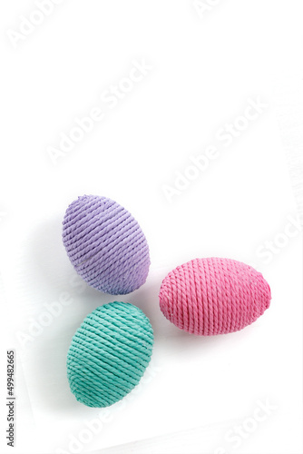 Making Easter eggs from multi-colored threads. Handmade  amigurumi