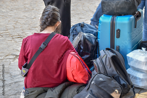 Obraz na plátně A girl from Ukraine arrived with her family at a train station in Poland