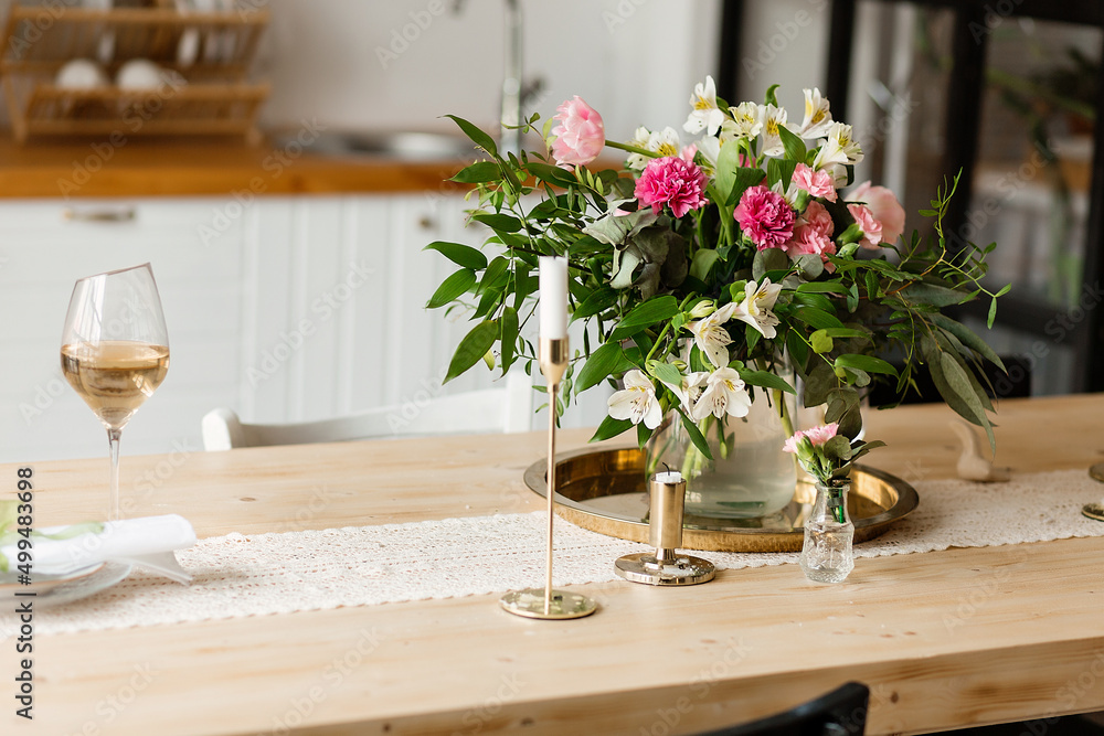 Beautiful fresh ranunculus on table in kitchen Beautiful fresh ranunculus on table in kitchen