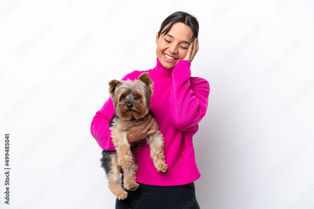 Young hispanic woman holding a dog isolated on white background has realized something and intending the solution Young hispanic woman holding a dog isolated on white background has realized something and intending the solution