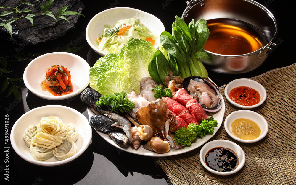 Ingredients for shabu-shabu cooking on a black background Ingredients for shabu-shabu cooking on a black background