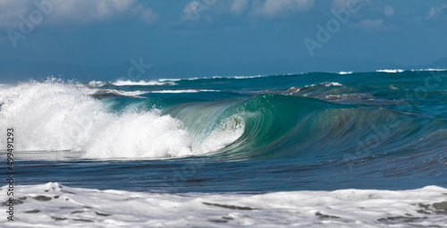 Ocean Wave Closeup Water. Ocean wave closeup detail of upright crashing hollow breaking water. energy power of nature. © Armensl