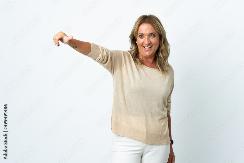 Middle aged blonde woman over isolated white background giving a thumbs up gesture Middle aged blonde woman over isolated white background giving a thumbs up gesture