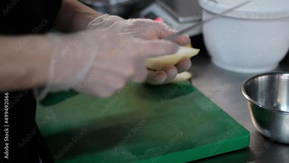 Close-up video of cutting slicing fresh peas. Womans hands cut with knife fresh pear fruits Close-up video of cutting slicing fresh peas. Womans hands cut with knife fresh pear fruits