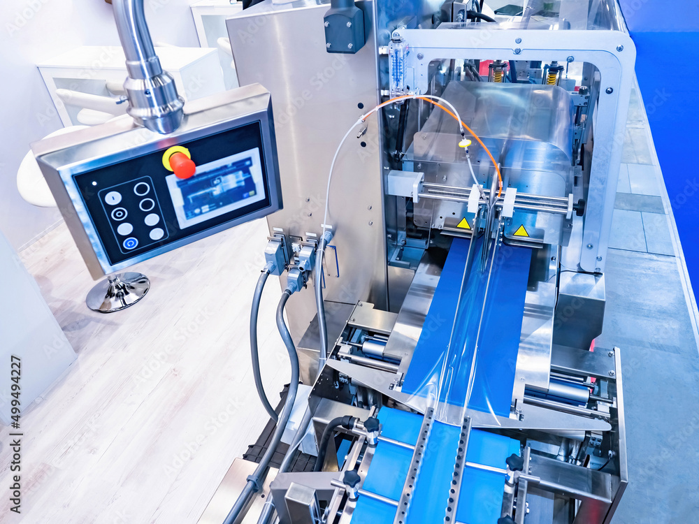 Packaging conveyor in the food industry. Conveyor line for packaging products in polyethylene