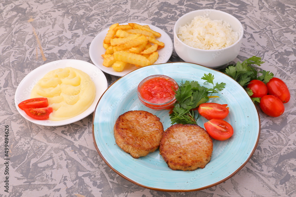 cutlet with sauce and side dish of potatoes rice mashed potatoes with vegetables photo dishes for the menu of restaurants and cafes