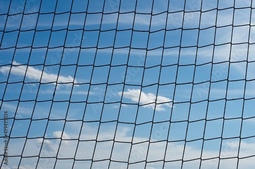 clouds behind a net. concept of deprivation of liberty