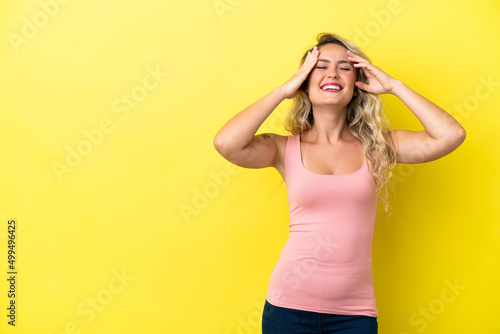 Young Brazilian woman isolated on yellow background laughing