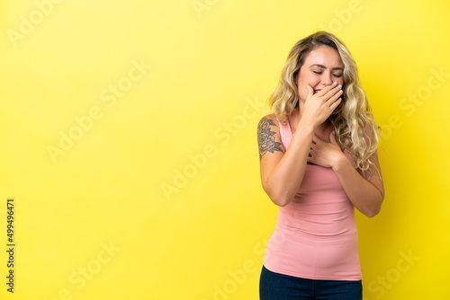 Young Brazilian woman isolated on yellow background coughing a lot