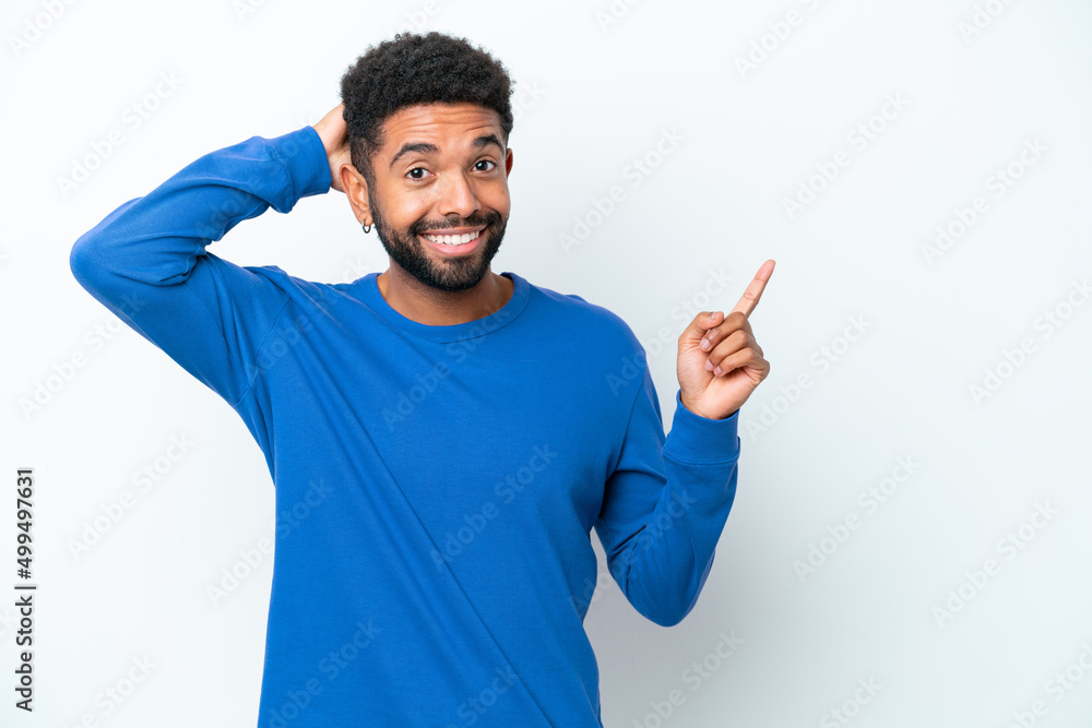 Young Brazilian man isolated on white background surprised and pointing finger to the side Young Brazilian man isolated on white background surprised and pointing finger to the side